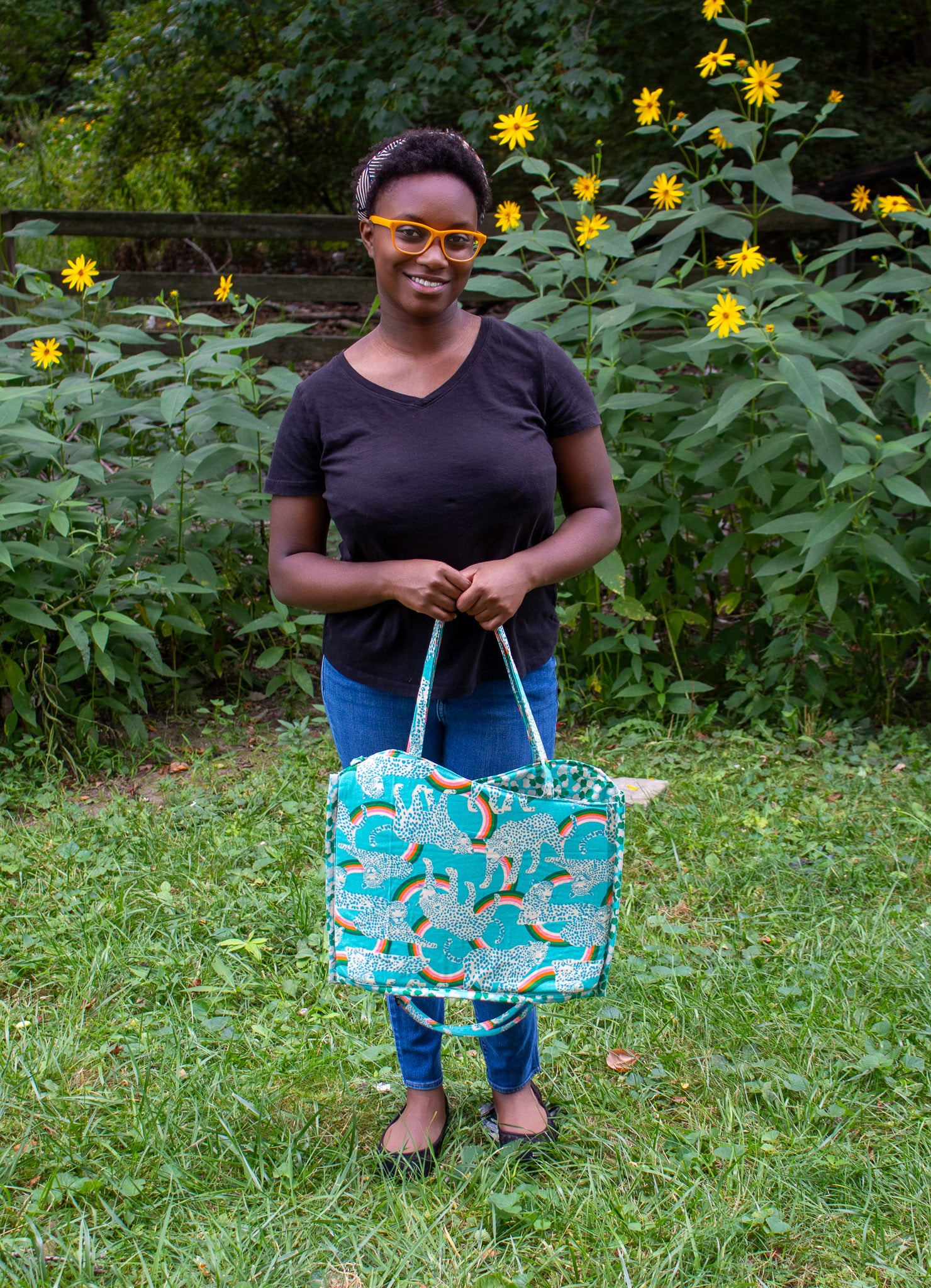 Image of blue rainbow Rivet Patterns Wave Top Tote being held