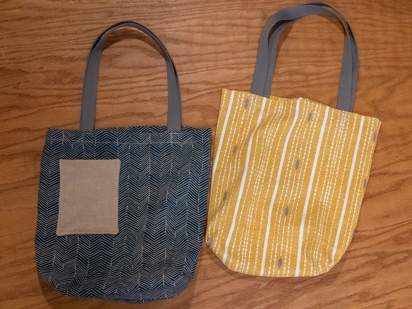 Image of blue and yellow Rivet Patterns Forte Tote Bags flat lays